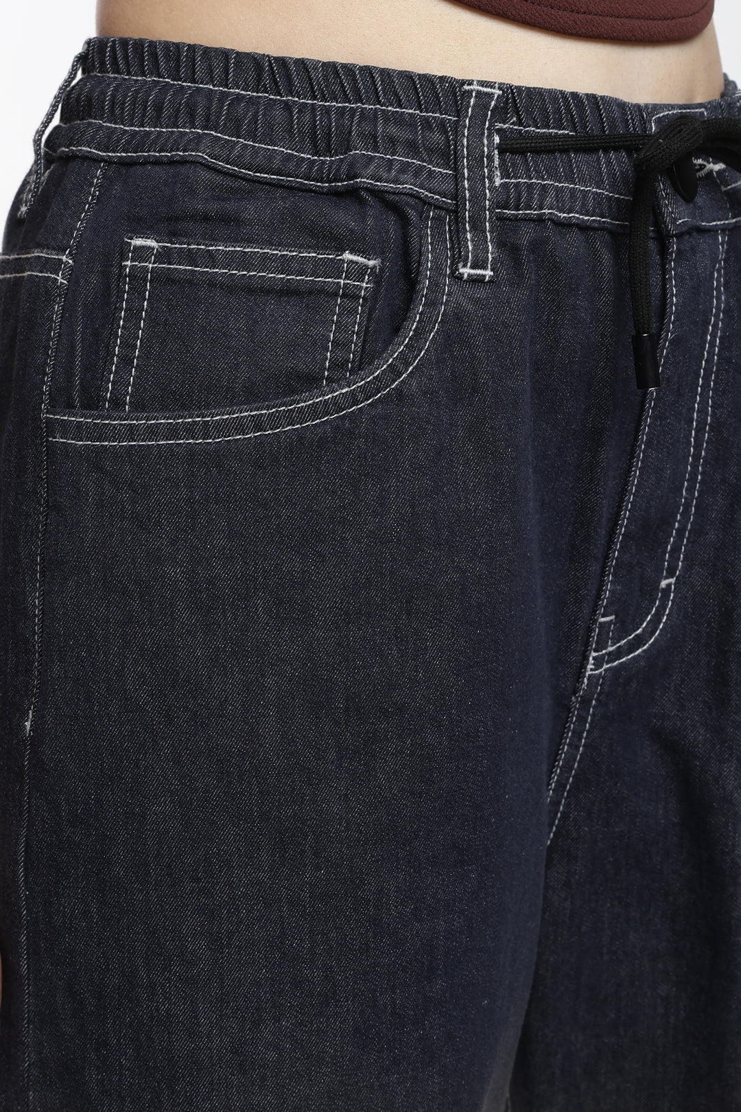 Close-up of vintage wash jogger with a focus on the waistband and pocket area.