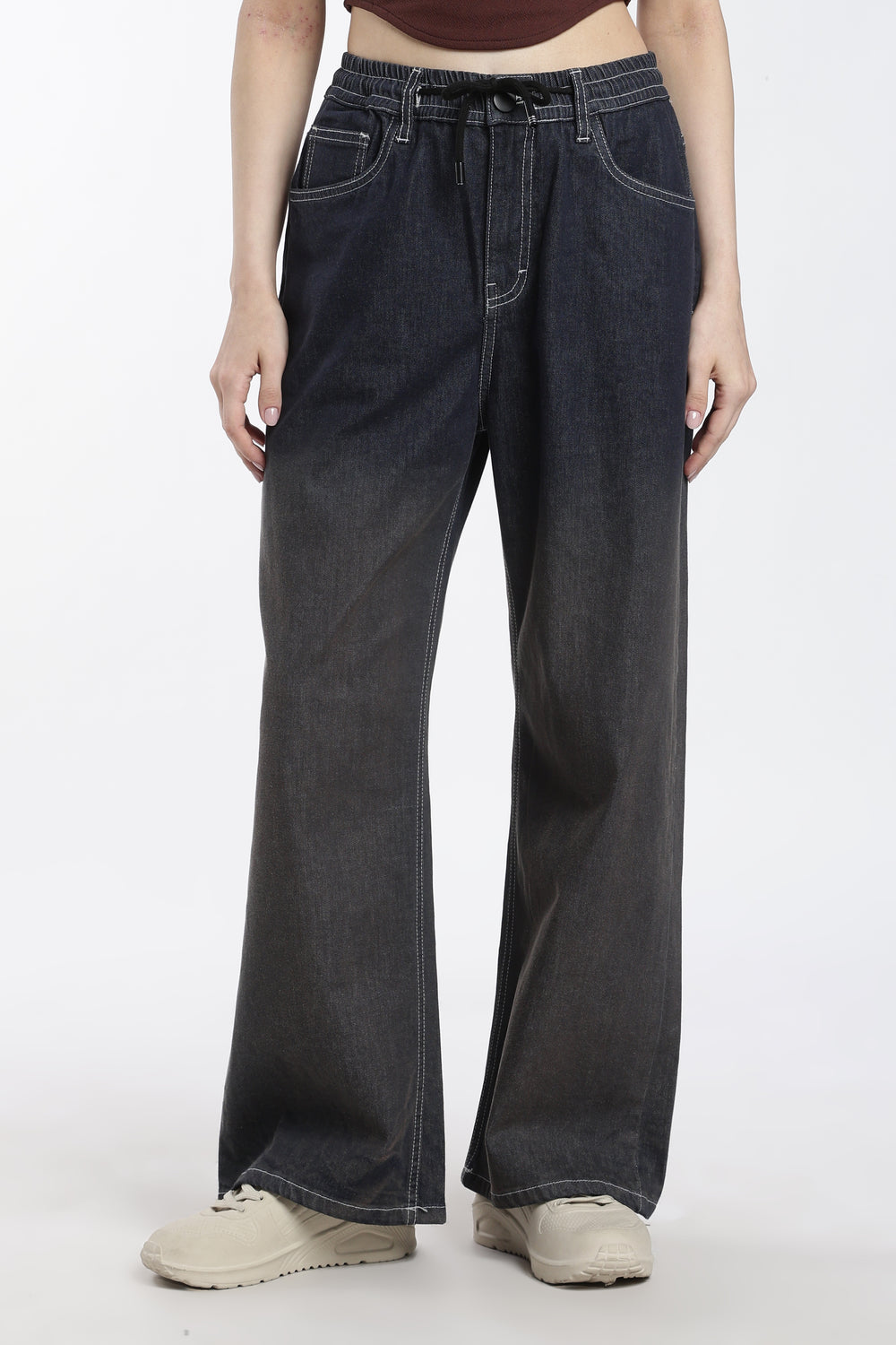 woman wearing vintage wash wide-leg jogger on a white background