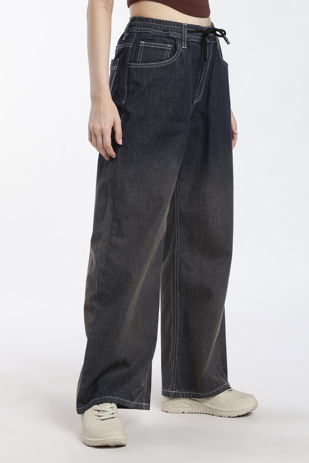 woman wearing vintage wash wide-leg jogger on a white background