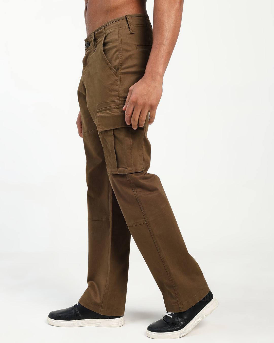 Brown cargo pants worn by a man on a white background