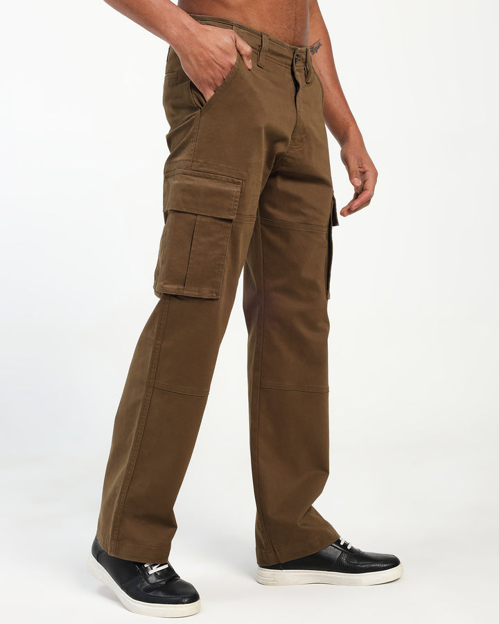 Brown cargo pants worn by a man on a white background