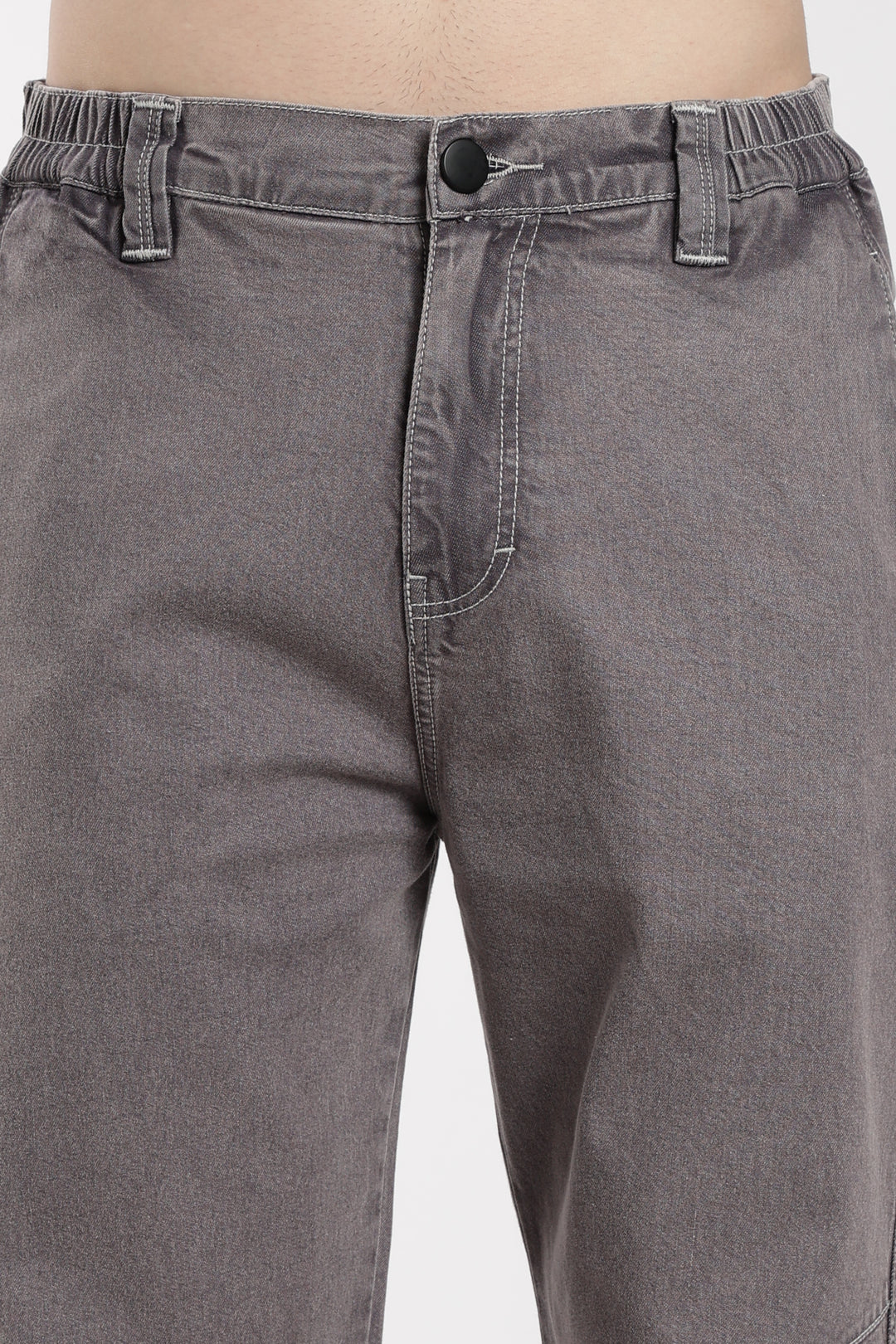 Close-up of gray jogger on a plain background