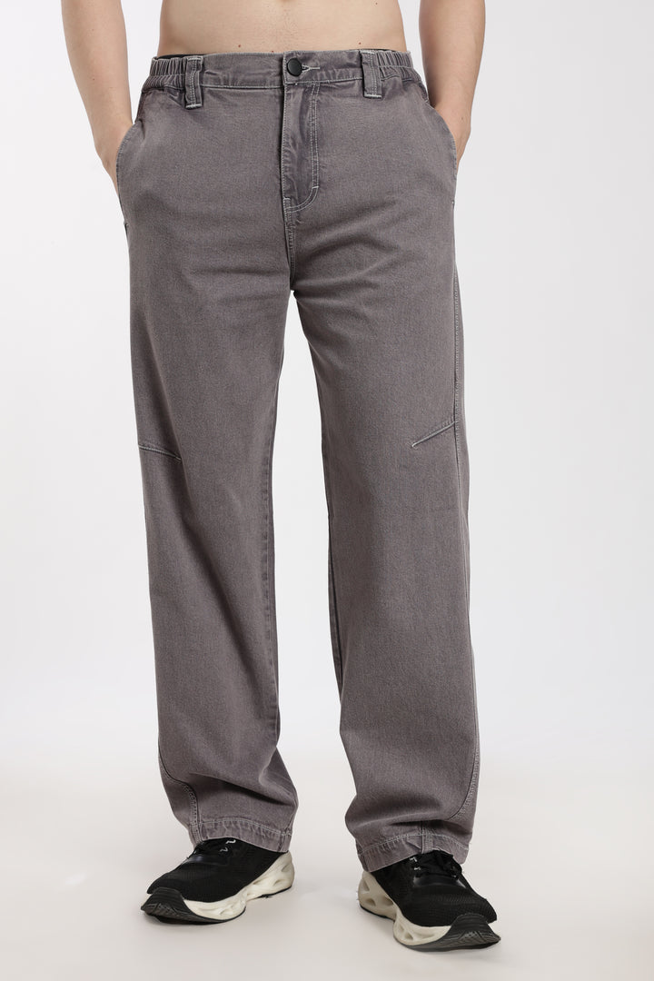 man wearing gray jogger on a white background