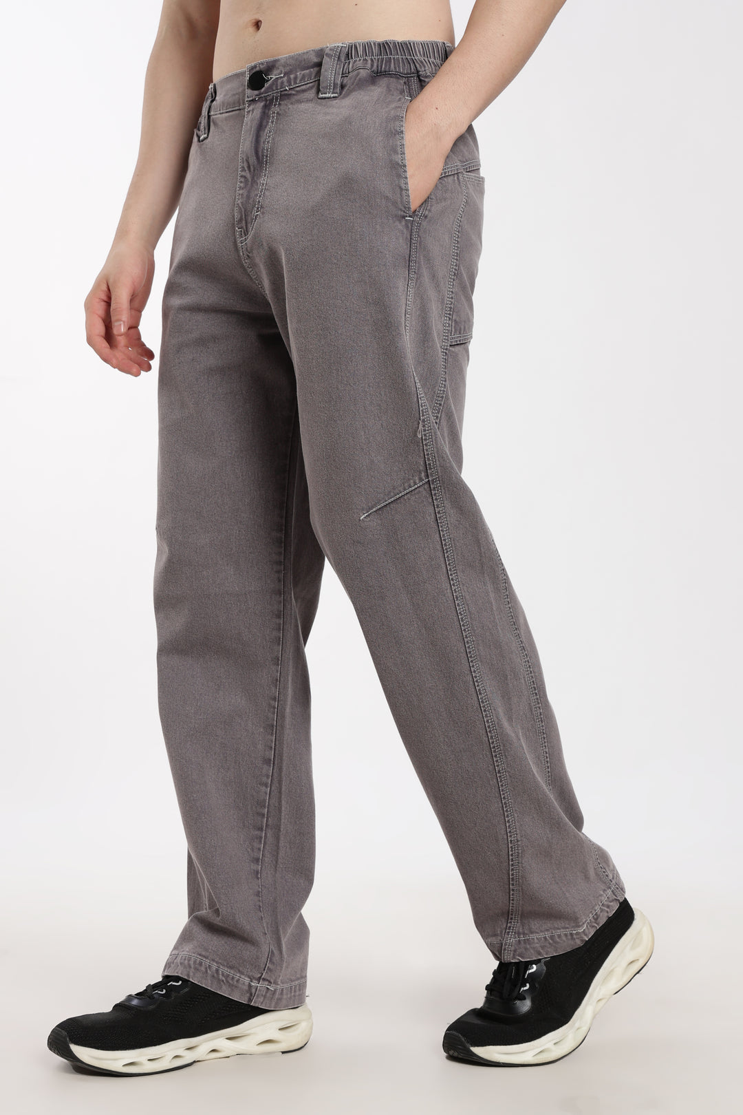man wearing gray jogger on a white background