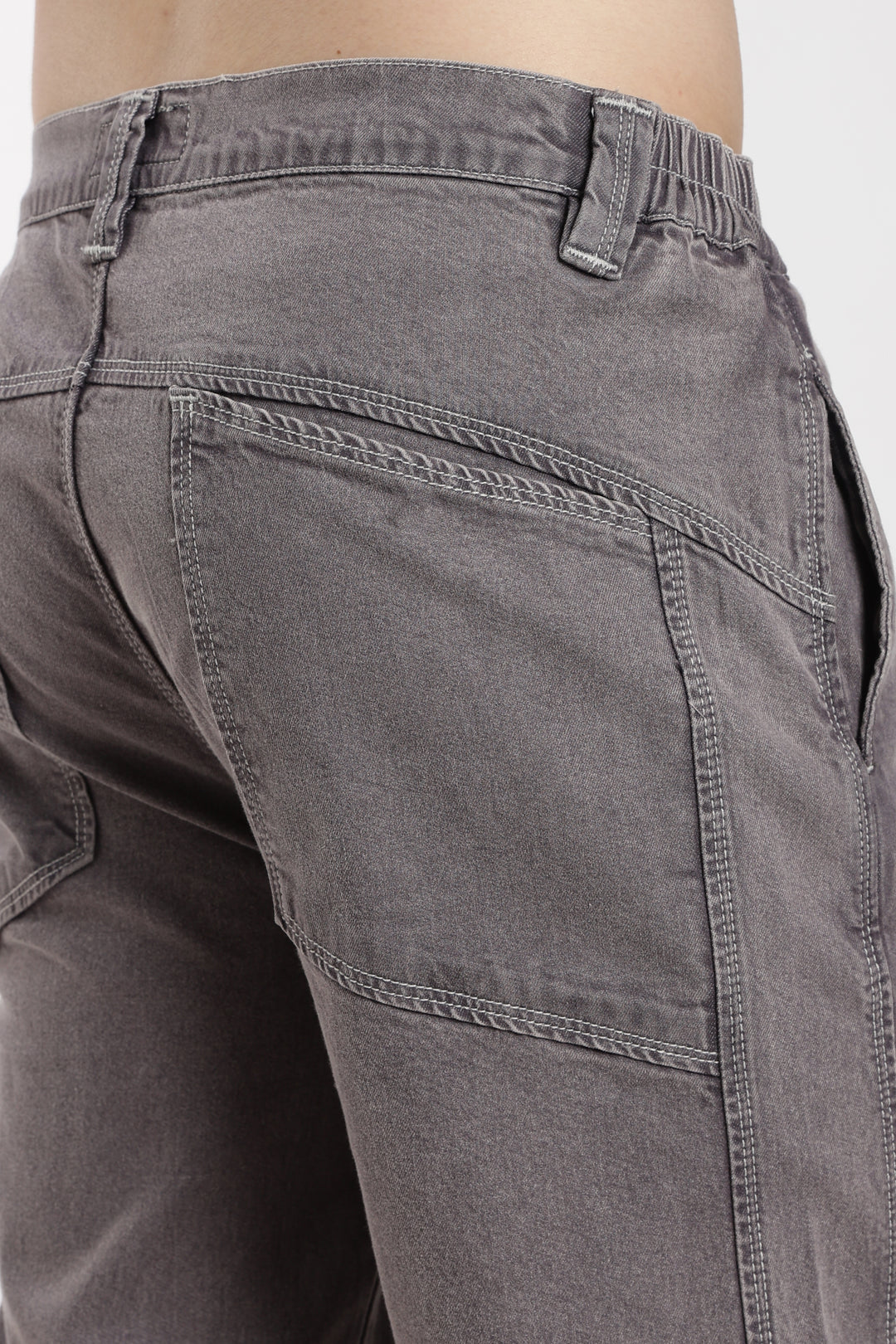 Close-up of gray jogger with a white background