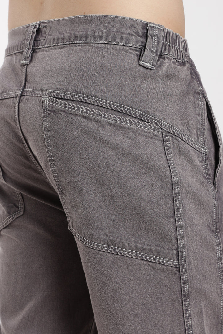 Close-up of gray jogger with a white background