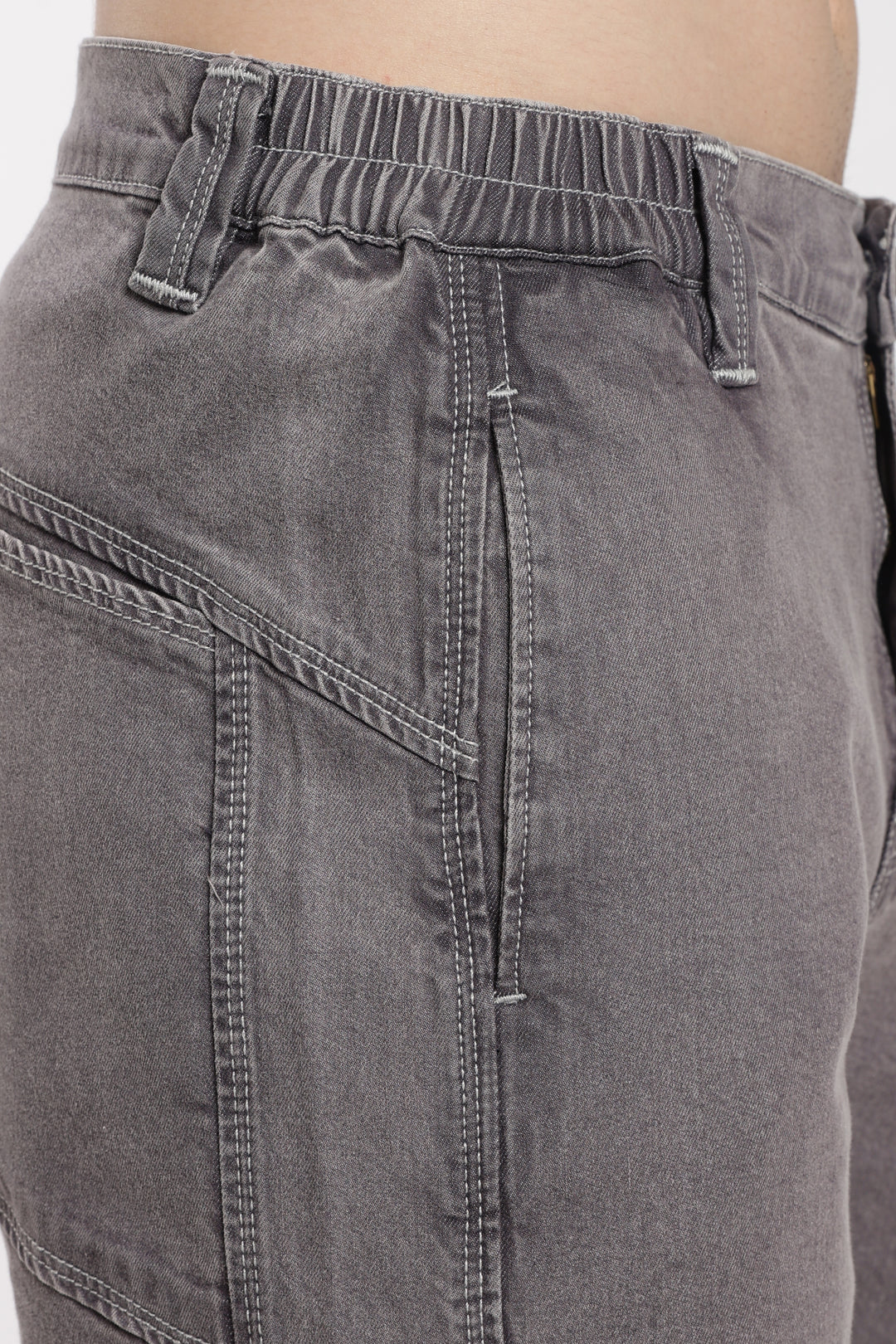 Close-up of gray jogger with a plain background