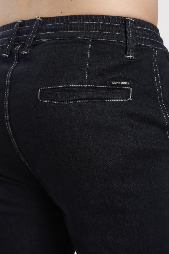 blue jogger with a brand sint jones on the pocket against a white background