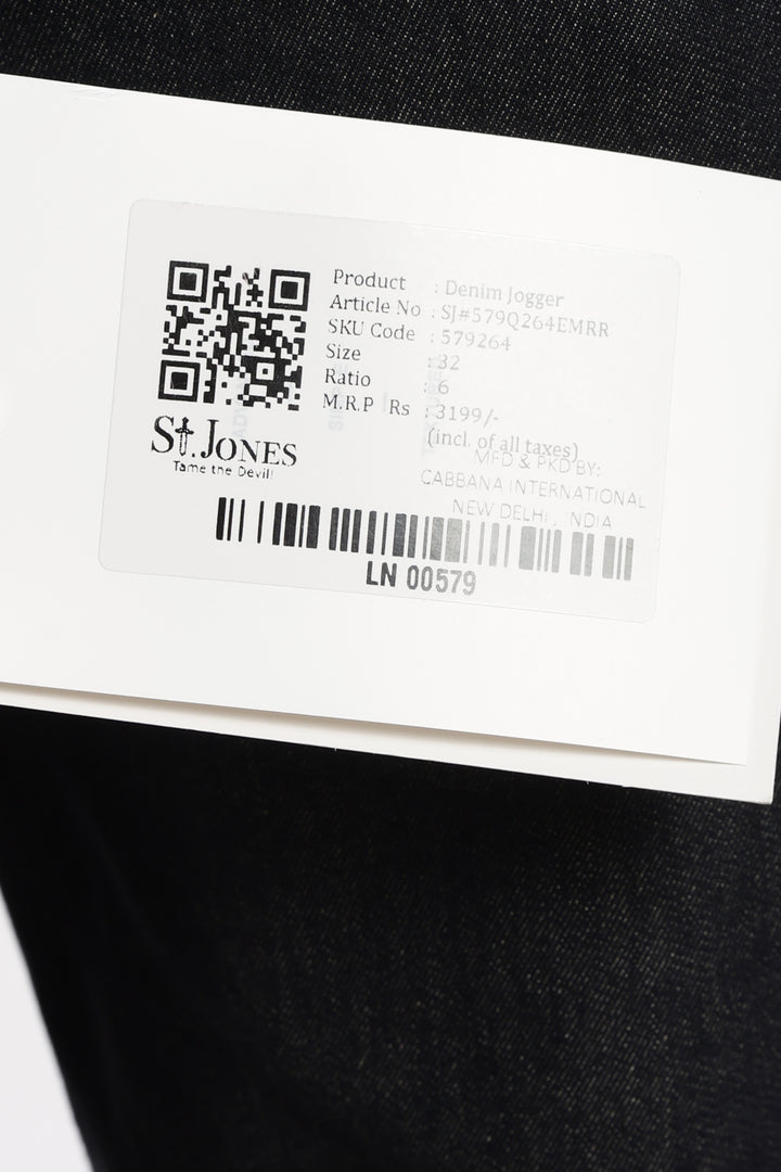 Close-up of a label on a black garment with 'St. Jones' branding.