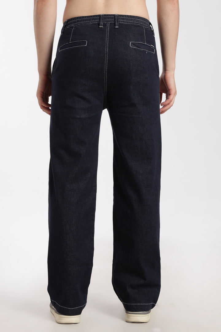 man wearing navy blue denim jogger pant on a white background
