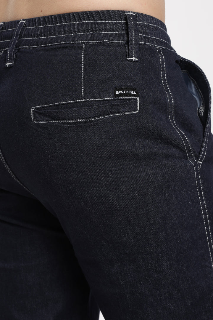 navy blue denim jogger pants with 'Saint Jones' branding on the back pocket against a white background