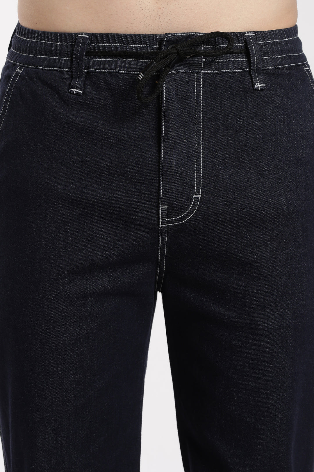 navy blue denim jogger pants with a drawstring waistband on a white background