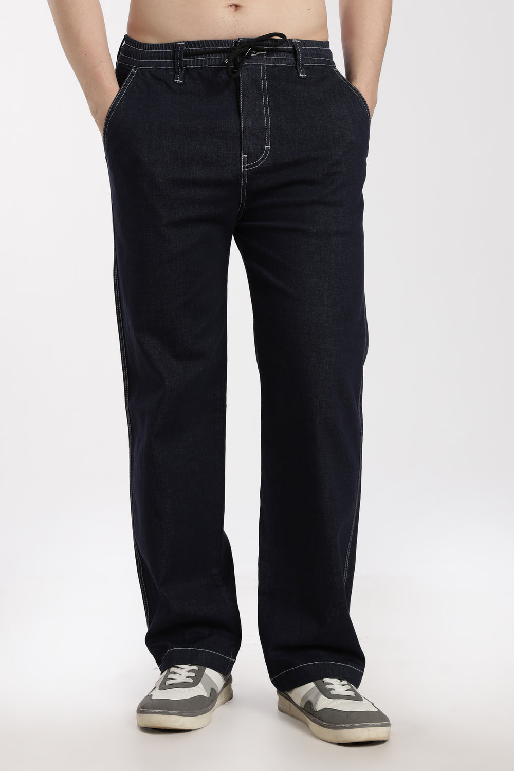 man wearing navy blue denim jogger pant on a white background