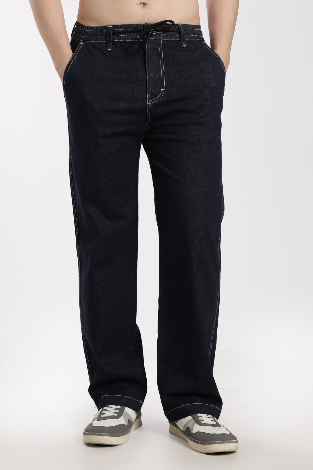 man wearing navy blue denim jogger pant on a white background