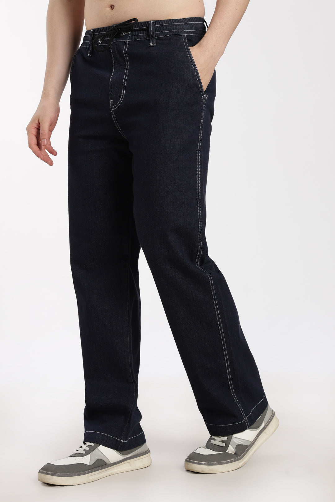 man wearing navy blue denim jogger pant on a white background