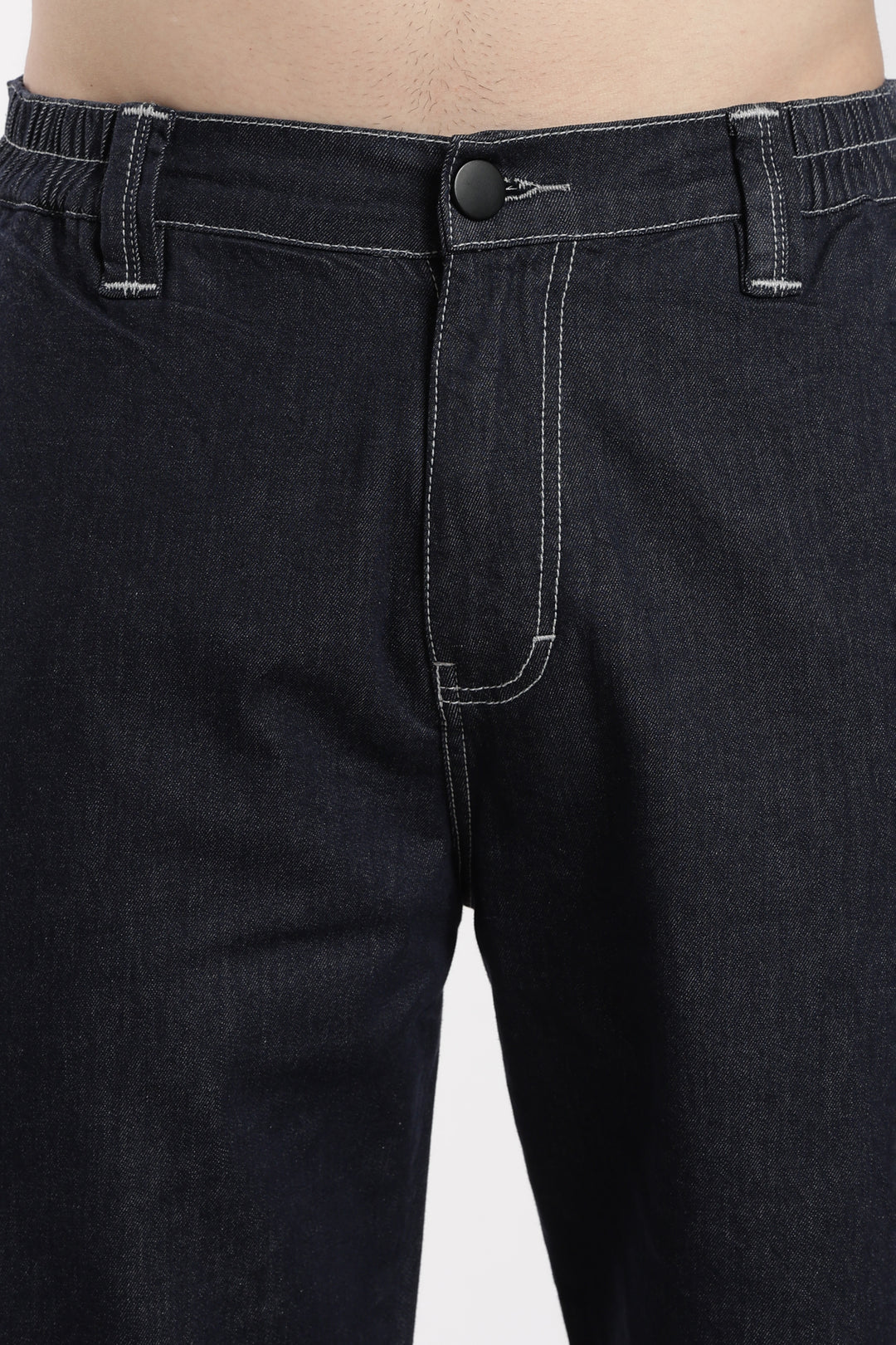 Close-up of blue denim jogger on a white background