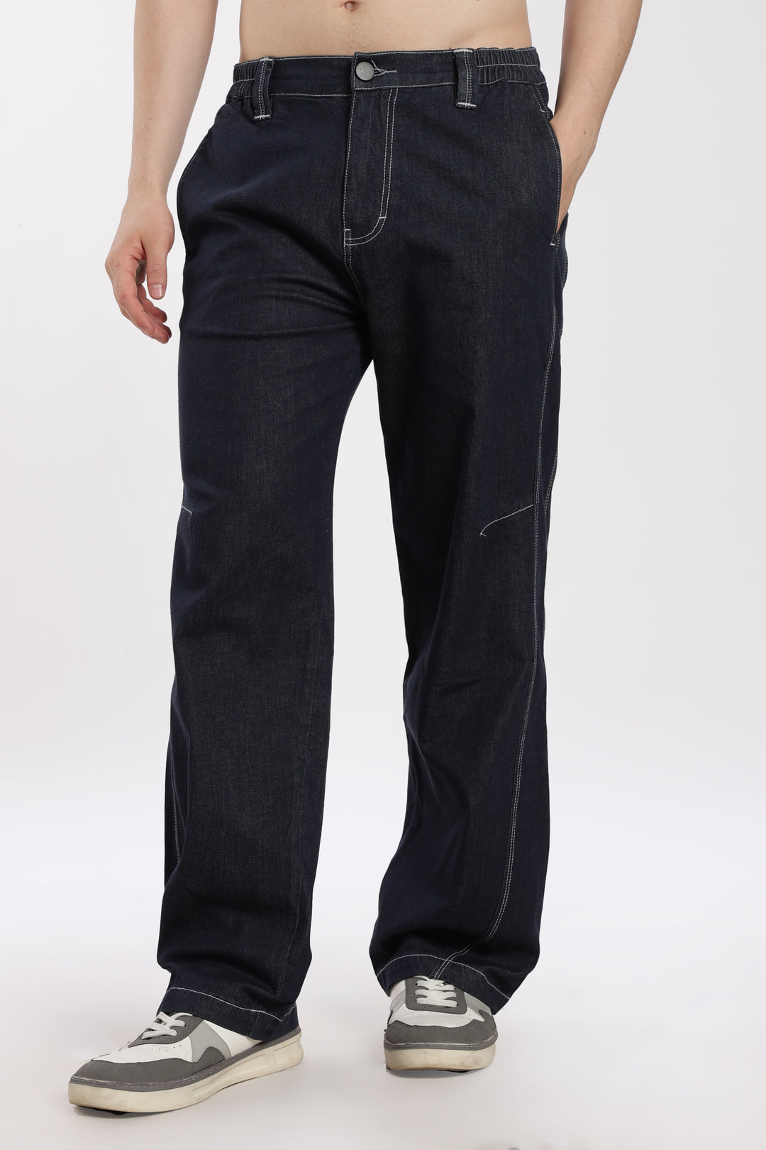 man wearing blue denim jogger on a white background