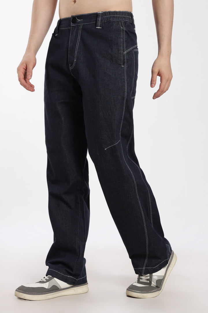 man wearing blue denim jogger on a white background