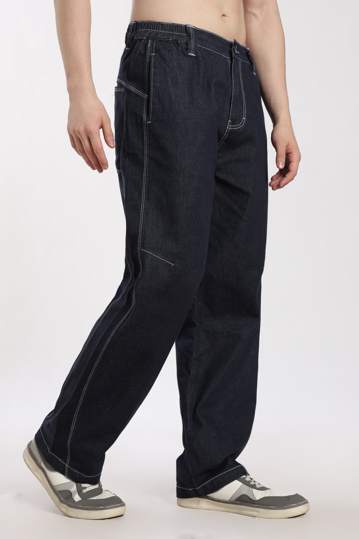 man wearing blue denim jogger on a white background