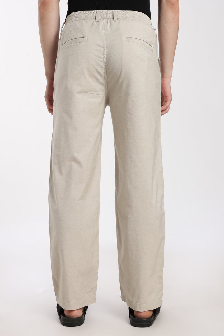 desert sand  pants worn by a man on a white background
