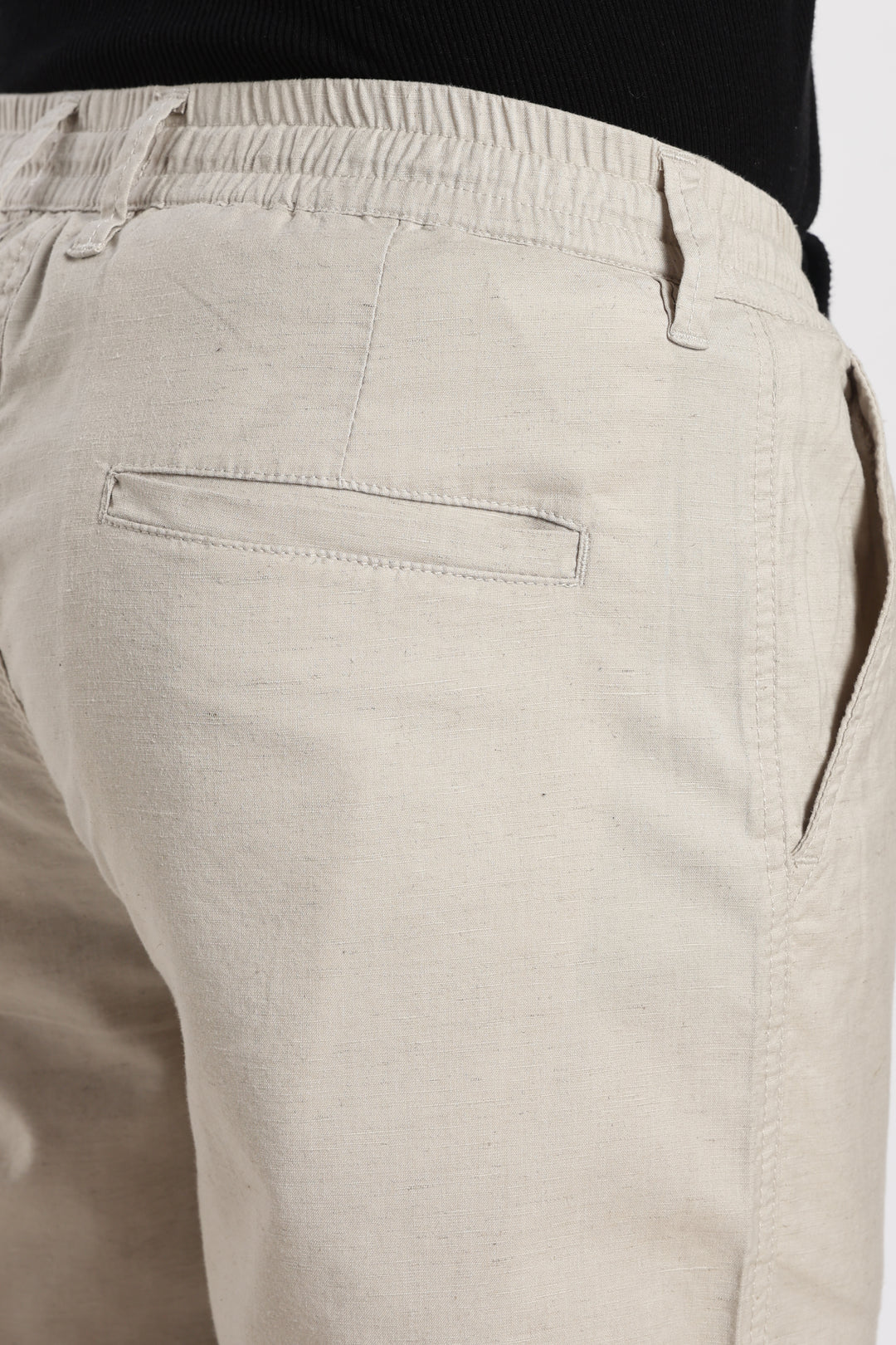 sand linen pants with a plain background