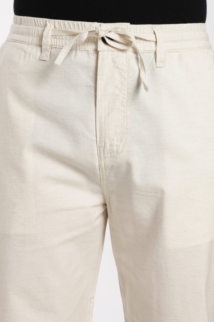 cream linen pants with drawstring on a white background