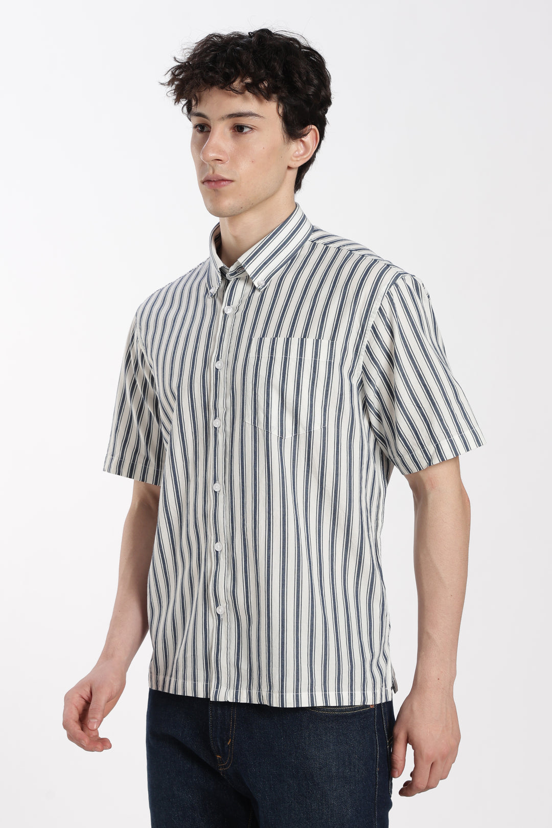 Man wearing a striped half sleeve shirt on a white background