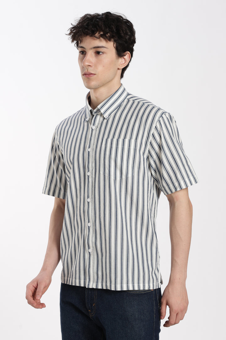Man wearing a striped half sleeve shirt on a white background