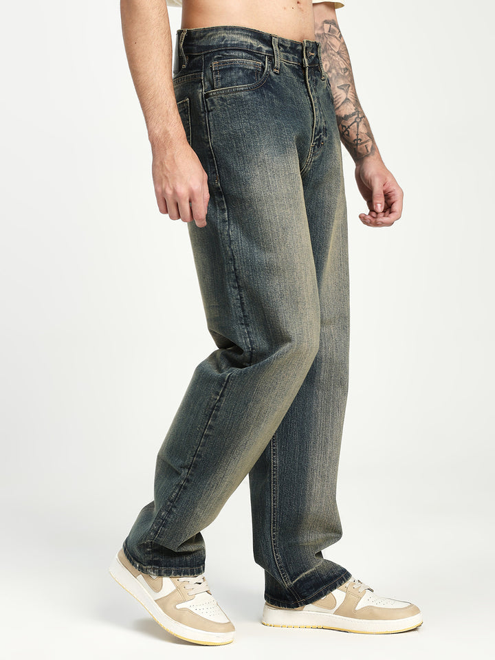 man wearing blue jeans on a white background