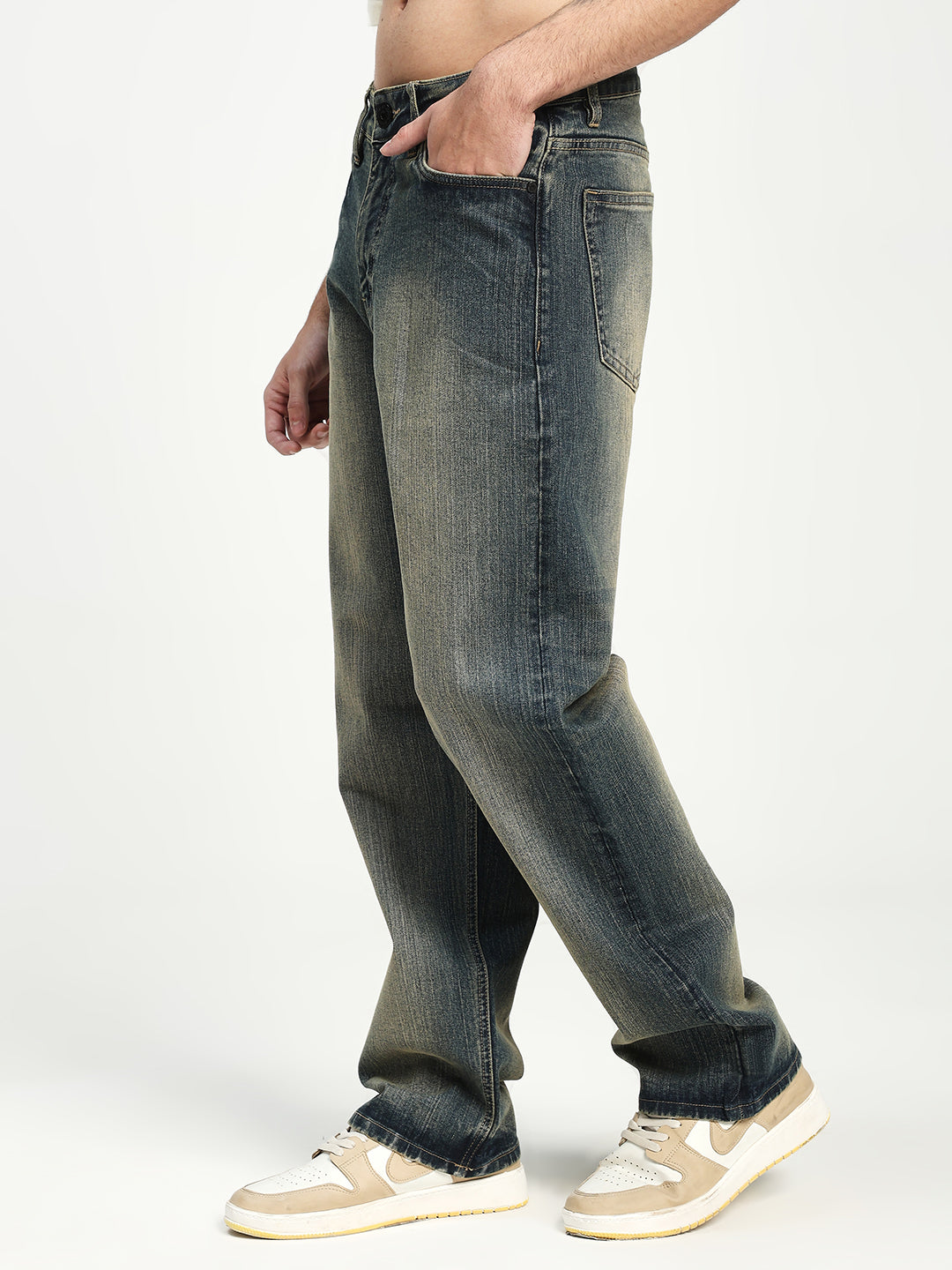 man wearing blue jeans on a white background