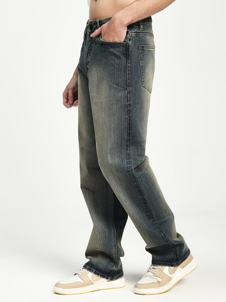 man wearing blue jeans on a white background