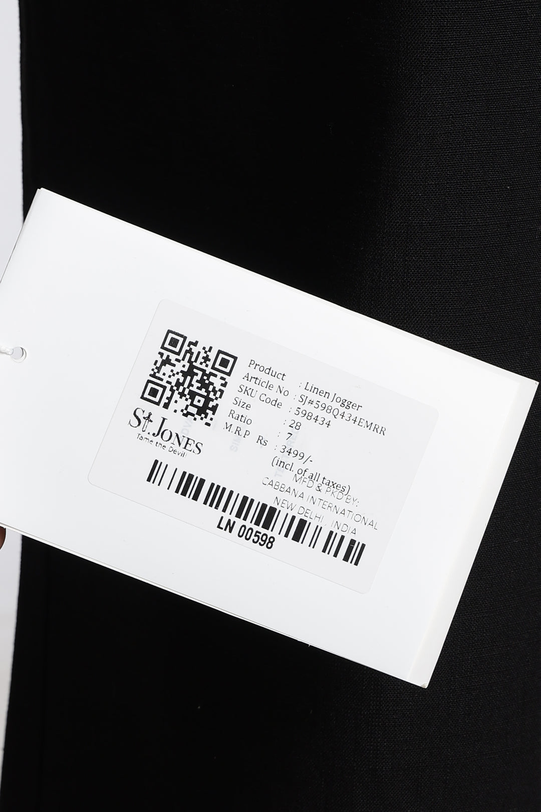 Product label with QR code and text on a black background